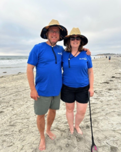 Two people smiling at the beach